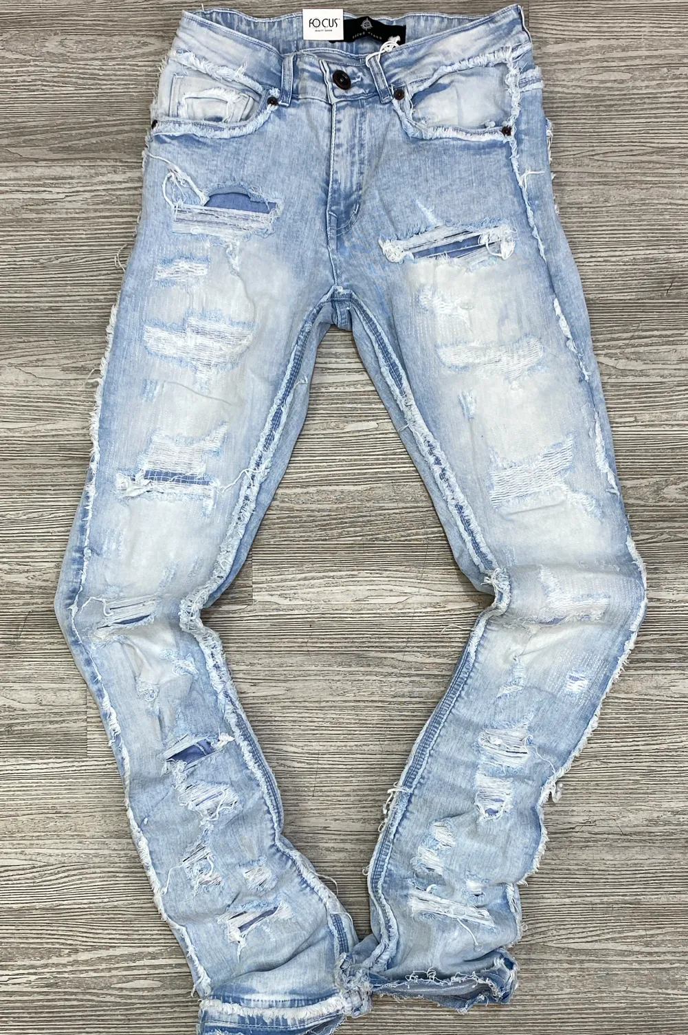 Focus- heavy distressed stacked jeans( ice blue)